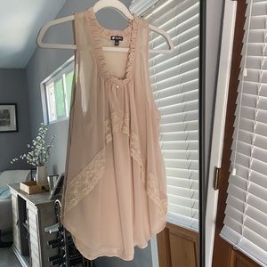 Lily White size medium top with ruffle and lace detail.